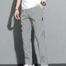 Våren män Sweatpants Loose Stretch Active Track Joggers fickor Gymträning Pants Casual Male Solid Color Trousers