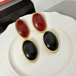 Europe and the United States light luxury retro senior sense wine red resin oval earrings simple temperament fashionable personality stud female