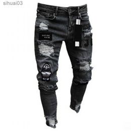 Men's Jeans Mens Elastic Tear Tight Bicycle Bra Cartoon Printed Jeans Damaged Hole Slim Fit Denim High Quality Hip Hop Black JeansL2403