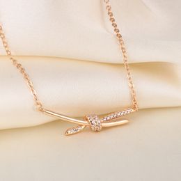 New T home light luxury Valley Ailing with rose gold necklace cross knot knot knot tide diamond pendant female