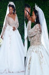 Plus Size African Wedding Dresses 2021 Luxury Beaded Lace Long Sleeve Princess Church Garden Bridal Dress robe mariage5212011