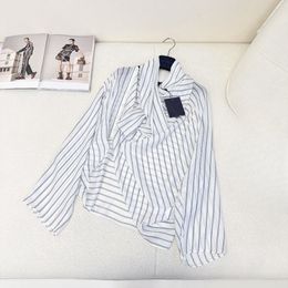 Designer designs the latest runway show with the same letter striped pile neck long sleeved shirt