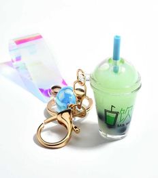 Cute Mini Bottle Keychain Diy Milk Tea Keyring Moving Liquid Bag Charm Jewellery Accessories Women Luxury Cool Gift Whole G10191041036