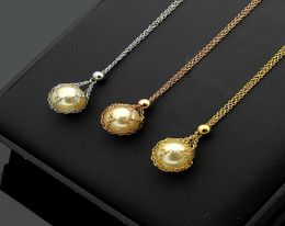 New titanium steel jewelry mesh bag white pearl couple pendant love necklace ladies pearl necklace long 46cm pendant diameter 12c8021251