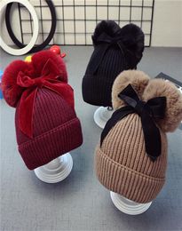 9styles Cute Double Fur Ball Bow Hats Baby Pom Pom Beanie Cap Toddler Kids Baby Girls Winter Warm Crochet Knitted Party Hat Ca4059945