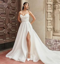 Elegant lång älskling satin bröllopsklänningar med slits a-line elfenben ärmlöst sveptåg spetsar upp enkla brudklänningar med fickor för kvinnor