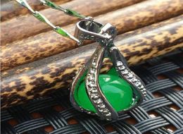 Natural oil green Malay jade hollowout pendant with ship ping X1103300375