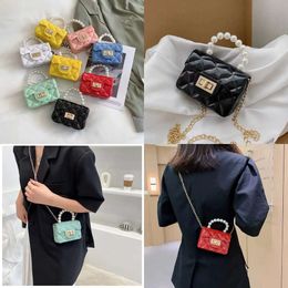 High HBP Quality Mini Girl Case Women Handbag Kids Baby Purse Fashion Niche Design Jelly Shoulder Texture Pearl Chain Bags Cute Small Handbags s