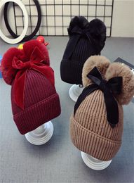 9styles Cute Double Fur Ball Bow Hats Baby Pom Pom Beanie Cap Toddler Kids Baby Girls Winter Warm Crochet Knitted Party Hat Ca7237944