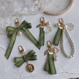 Designer keychain Luxury key chain bag charm female car key ring Pearl charm green ribbon delicate shells keychain couple pendant gift nice good