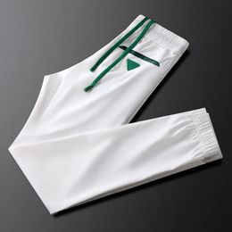 European Summer Lightweight White Sports Casual Pants Mens Ice Silk Breathable Guard Fashion Brand 9point 240417