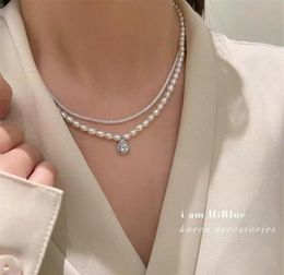 Korean Version of The New Freshwater Pearl Necklace Retro Multilayer Temperament Clavicle Chain Platinum Plated Zircon Pendant Cr2804644