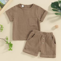Summer soft cotton childrens and boys clothing set casual pocket button short sleeved top solid color shorts 2PCS childrens and baby clothing 240429