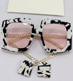Womens sunglasses 0722S fashion classic black and white Colour matching frame pink lens metal chain temple with pendant personality8266466