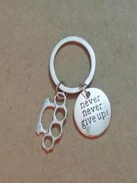Never Give Up Brass Knuckle Dusters Metal Alloy Keychain For Keys Car Bag Key Ring Handbag Couple Key Chains Jewelry Men Gifts 7051249353