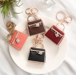 Fashion luxury keychain ornaments Party Favor creative leather bag custom metal car pendant small gifts individual package6436304