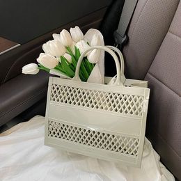 Factory outlet ladies clutch bag summer romantic holiday Candy colored beach bag light hollow jelly bag small fresh washing storage basket women's handbag 9944#