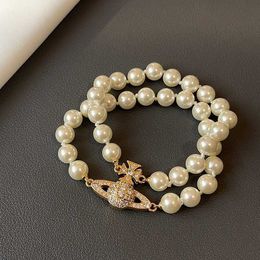 Designer Queen Mother of the Double Layer Pearl Saturn Magnetic Buckle Bracelet Womens Classic Diamond