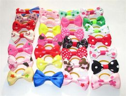 100pcs New Dog Hair Clips Small Bowknot Pet Grooming Products Mix Colours Varies Patterns Pet Hair Bows Dog Accessories252m2005269