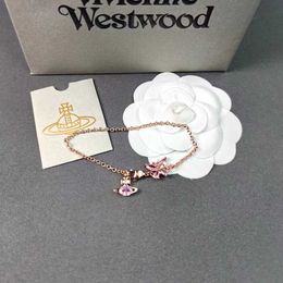 Designer New Westwood Pink Diamond Crystal Bow Saturn Bracelet Womens Sweet Hicraft White Green Tricolour