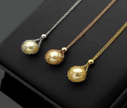 New titanium steel jewelry mesh bag white pearl couple pendant love necklace ladies pearl necklace long 46cm pendant diameter 12c8095507