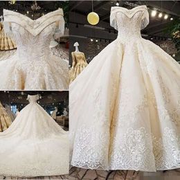 A bola de bola com miçanga com vestidos elegantes de bordado de ombro de renda de renda de tule berço de casamento vestido de noiva