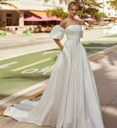 Elegant Long Strapless Pleated Top Satin Wedding Dresses with Pockets/Removable Puff Sleeve A-Line Ivory Sweep Train Lace Up Back Simple Bridal Gowns for Women