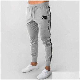 Pantaloni da uomo primavera e autunno marchio di moda maschile Strongman Sports Dstring Elastic Waist Feet Pants Pants di fitness SM-3XL Y0811 Drop de dh0ws