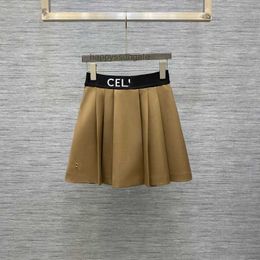 Skirts Luxury designers new mens and womens short sleeved sportswear set Shirt 2023 Early Spring Rubber Band Waist Pleated Half Lining Short Skirt Versatile