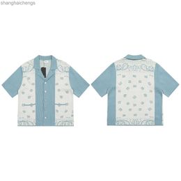 세련된 Rhuder 디자이너 셔츠 New Cashew Blossom Knitted Jacquard Polo Shirt for Men Womens 여성 캐주얼 느슨한 짧은 슬리브 가디건 패션 의류