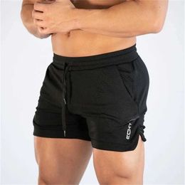 Shorts 2023 NEW Men's Fitness sports Shorts Man Summer Gyms Workout Male Breathable Mesh shorts Quick Dry Beach Short Pants men SportswearL.240507