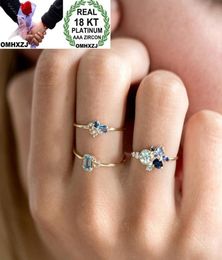 OMHXZJ Whole European Three Stone Rings Fashion Woman Girl Party Wedding Gift Slim Gold Blue Zircon 18KT Yellow Gold Ring Set 6621111