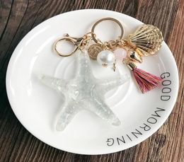 Starfish Keychain Couple Key Ring Shell Crafts Pearl Key Chains Lady Bag Pendant Necklace Light Bulb Ribbon Car Trendy Jewelry7484868