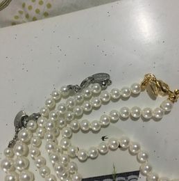 Fine Saturn Lady Pendant Necklace with Rhinestones Creative Planet Pearl Necklace Clothing Accessories Gifts for Friends a014115810