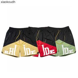 Rhude High end designer shorts for Chaopai micro letter printing color blocking casual shorts for men and women high street drawstring capris With 1:1 original labels