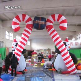 wholesale 4m 13ft Height Outdoor Inflatable Christmas Cane Arch Blow Up Penguin Holding Candy Cane For Entrance Decoration