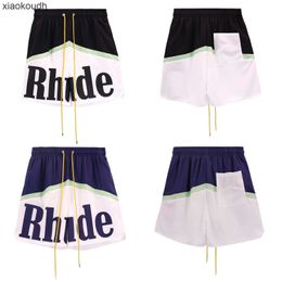 Rhude High End Designer 반바지 문자 패턴 인쇄 드로우 스트링 캐주얼 반바지 패치 워크 대조 1 : 1 원본 레이블을 가진 남성과 여성을위한 컬러 캐주얼 바지 대조