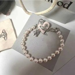 Designer Vw Love Pins Saturn Pearl Bracelet Womens Light Luxury Temperament Small Design High Edition Hwear