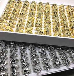 Whole 100pcs Mix Styles SilverGold Gothic Skull Jewellery Rings for Men Women Party Gifts Unique Punk Rock Biker Ring Brand New3602662