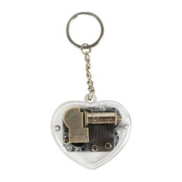 Musical Acrylic Heart Shape Keychain Wholesale Hand Novelty Items Crank Music Box Golden Movement Melody Castle In The Sky