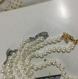 Fine Saturn Lady Pendant Necklace with Rhinestones Creative Planet Pearl Necklace Clothing Accessories Gifts for Friends a019792611