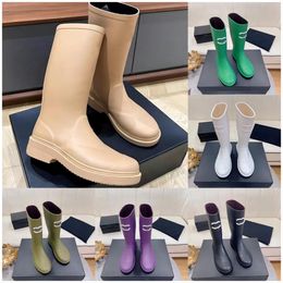 Designer qualidade feminino de luxo sapatos de joelho botas tornozelo grosso de plataforma de borracha de borracha alta de bota longa de bota masculina Botas de chuva de couro de viagem bota à prova d'água