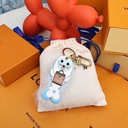 Designer Coulples Sunflower Key Wallet Luxury Brand Fawn Sea Lion Hairball Shoulder Bag Totes Luggage Pendant Brand Keychain Women Men 259w