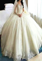 Romantic Dubai Arabic Wedding Gowns Sheer Jewel Neck LaceApplique Long Sleeves Bridal Gowns 2017 Glamorous Cathedral Train Weddin2754438