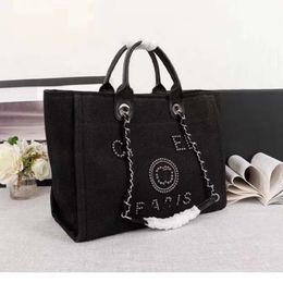 Designer Bag Women's Beach Bag Large Capacity Pearl Embroidered Canvas Handbag High Sensory Classic Chain Shopping Factory PromotionSWE0