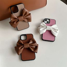 Litchi patterned large bow phone case suitable for iPhone 15/14 PROMAX solid color full package iPhone 13 PRO hard