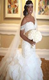 2020 New African Cheap Mermaid Wedding Dresses Off Shoulder Lace Appliques Organza Ruffles Tiered Crystal Beaded Plus Size Bridal 6563524