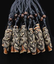 Lots Whole 12pcs COOL Boy men039s Simulation Bone Carving Totem Dragon Pendant Wood Beads Amulet Pendant Necklace Lucky Gif2687431