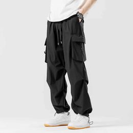 Men's Pants Mens Spring and Autumn Solid Colour Brushed High Waist Bandage Pocket Elastic Casual Loose Straight Cargo Pants J240507