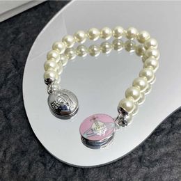 Designer Westwood enamel pearl bracelet with magnetic suction simple fashionable autumn winter high-end light luxury gifts for socialites